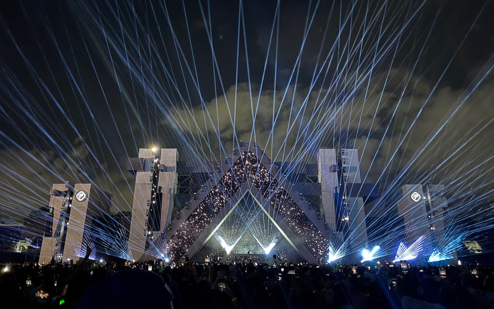 Lasers shine over crowd, in outdoor show
